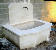 Old stone fountain of reconstituted limestone Old stone fountain of reconstituted limestone